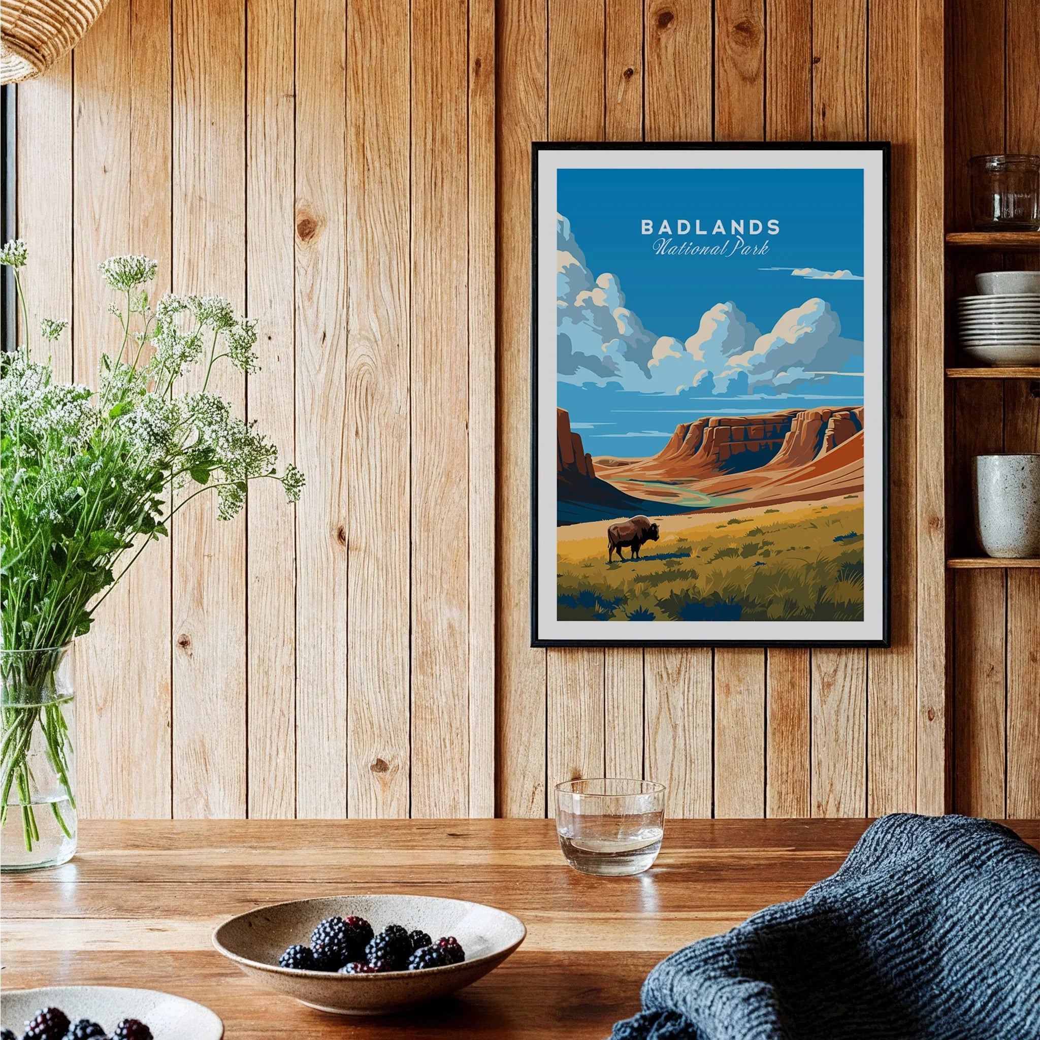 Badlands National Park art print in black frame hanging in rustic kitchen wall setting