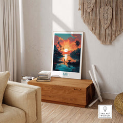 Bali wall art print in a modern living room with sunset and palm trees, adding tropical ambiance to the space.