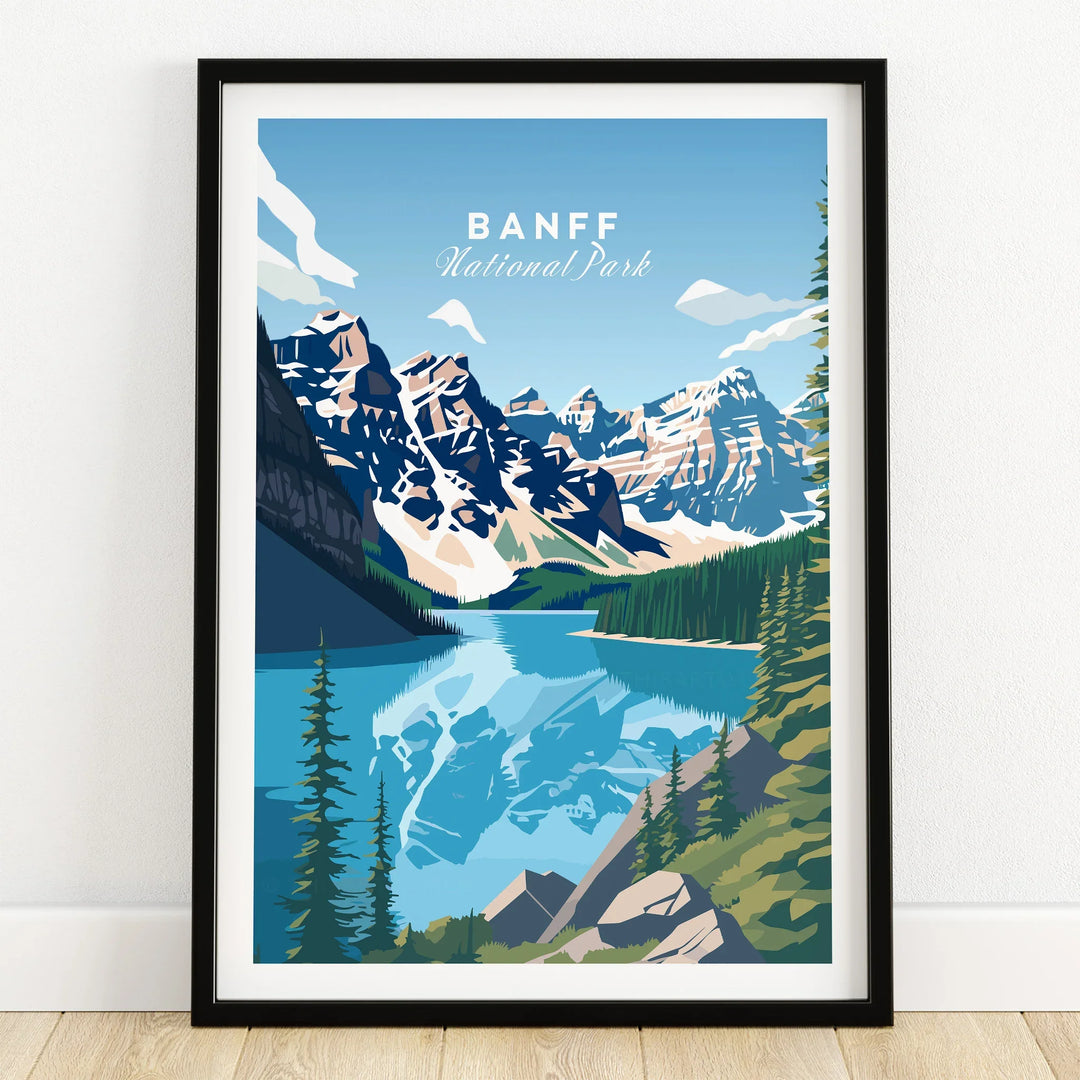 Banff National Park art print with mountains and lake in black frame on wooden floor