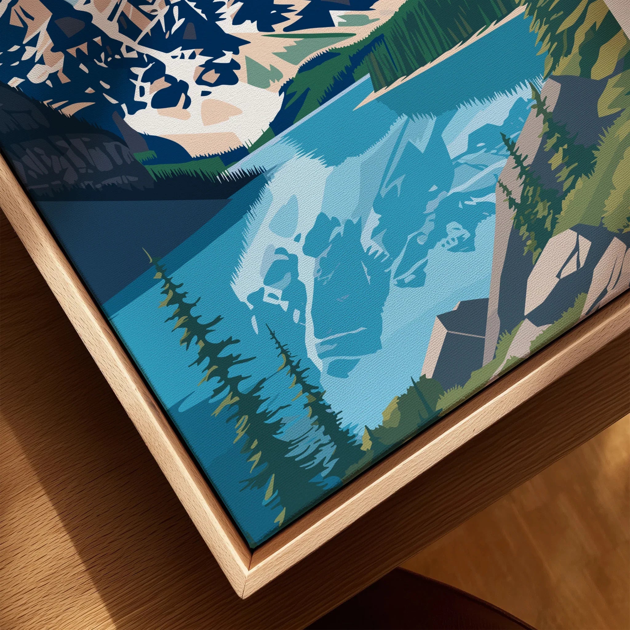 Closeup of framed Banff National Park print with lake, mountains, and pine trees