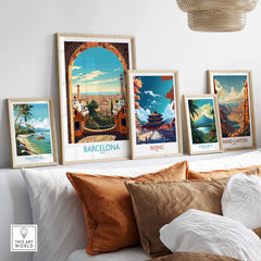 Vibrant Barcelona wall art framed alongside travel posters of Beijing, Costa Rica, Philippines, and the Grand Canyon.