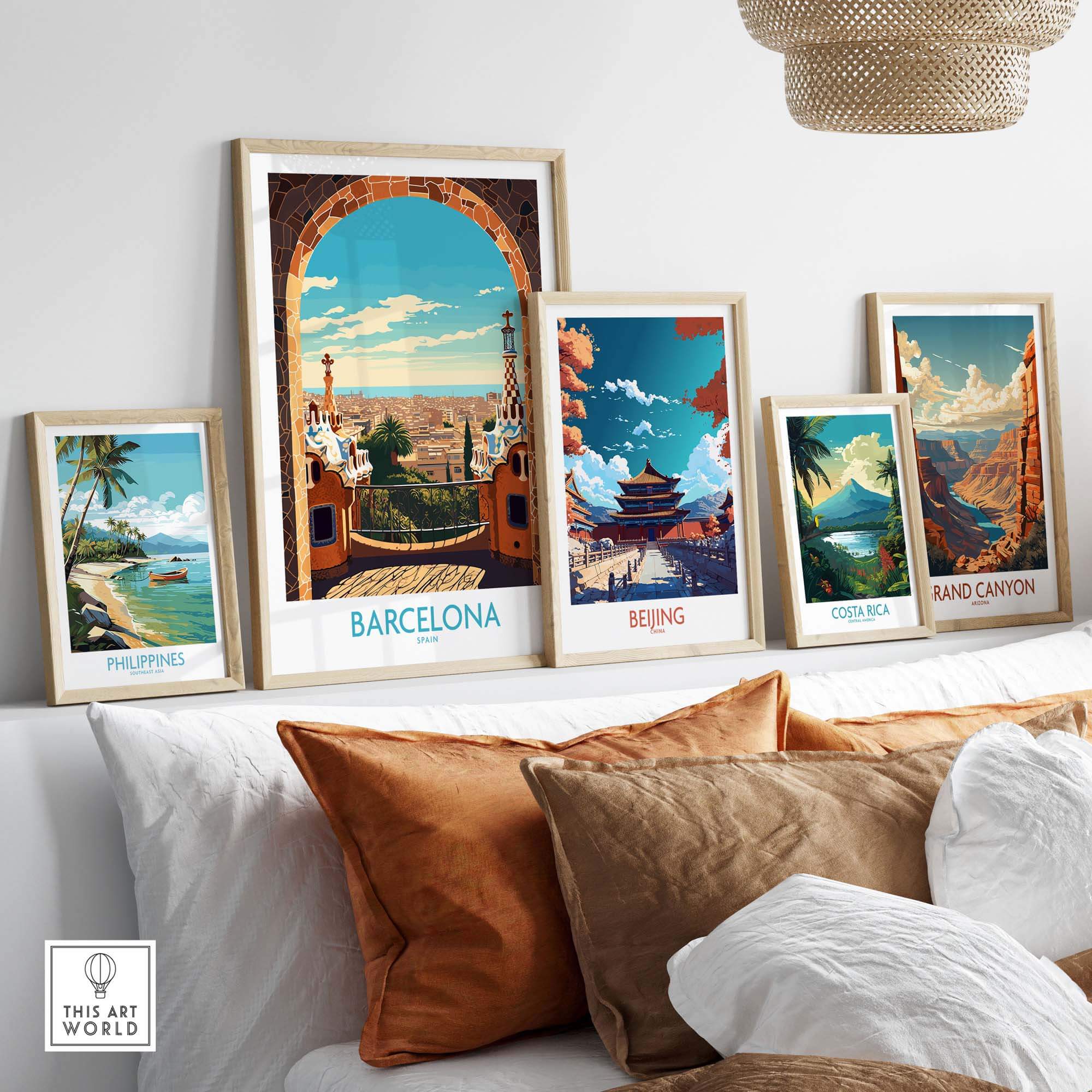 Vibrant Barcelona wall art framed alongside travel posters of Beijing, Costa Rica, Philippines, and the Grand Canyon.
