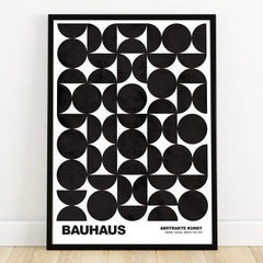 Bauhaus abstract art print with black geometric shapes in a black frame, modern wall decor