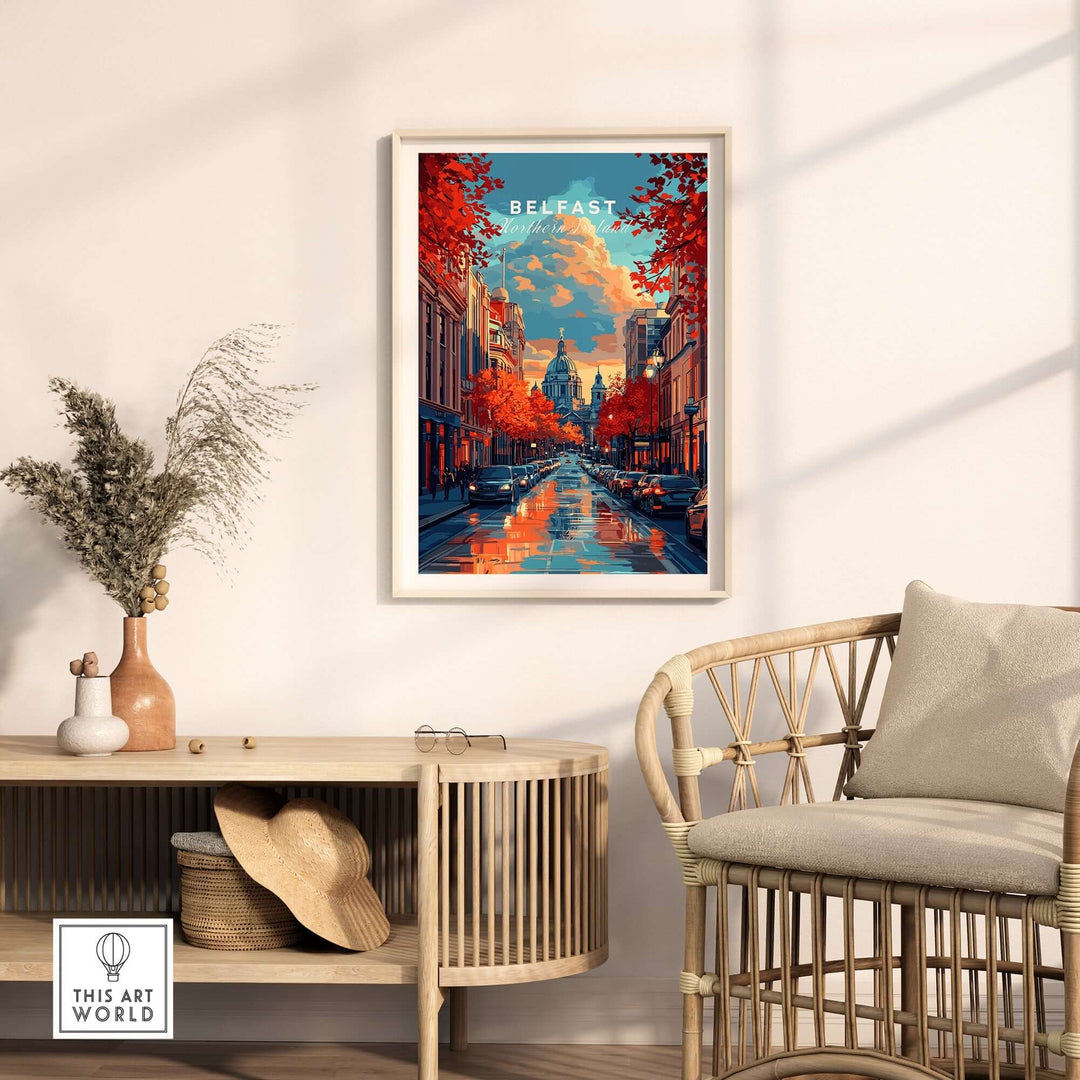 Belfast travel print showcasing vibrant cityscape with autumn trees, framed and displayed in a cozy interior setting.