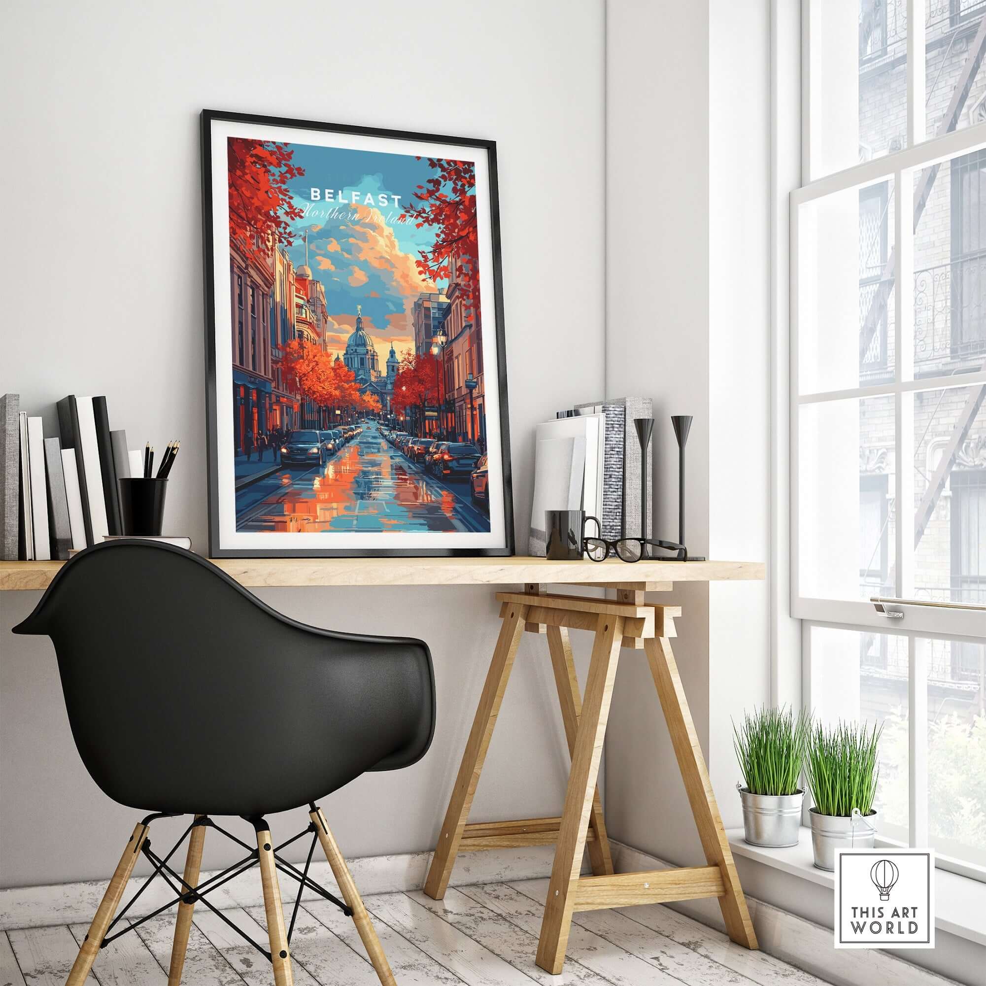 Belfast Travel Print displayed in modern workspace with black chair and artistic decor.