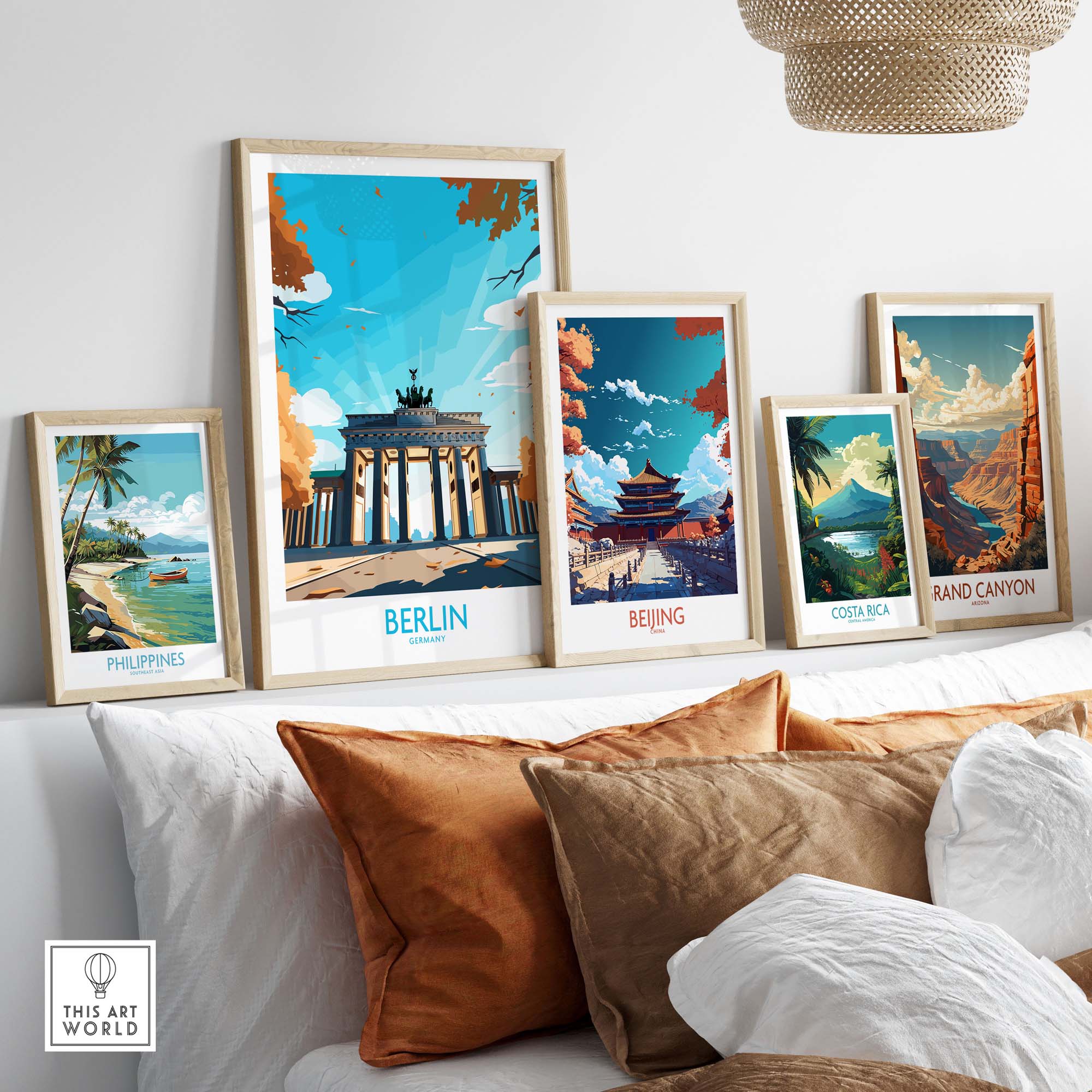 Modern Berlin Wall Art prints featuring Brandenburg Gate, displayed on a stylish wall above a cozy sofa.