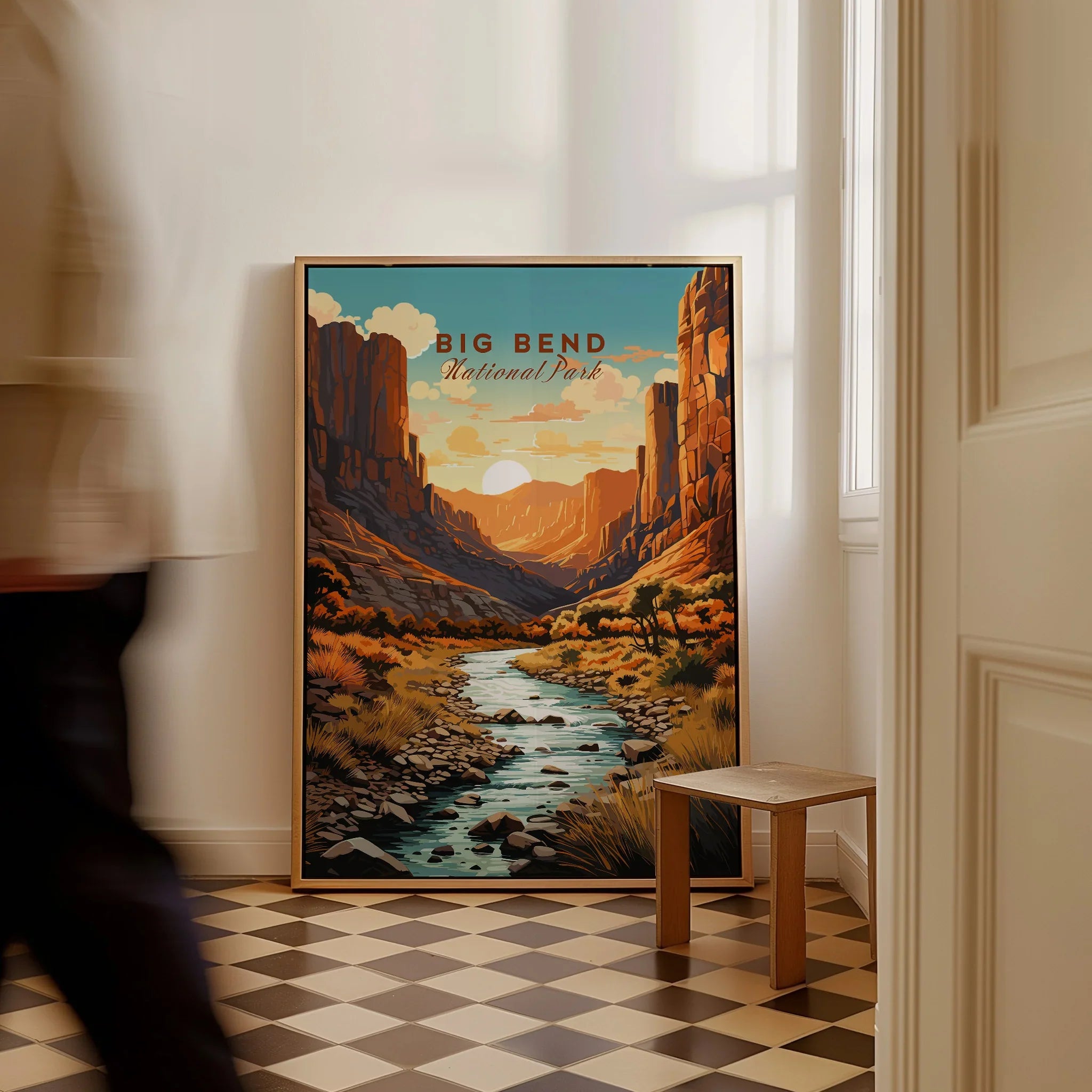 Big Bend National Park travel poster framed on floor in modern home hallway with man walking past