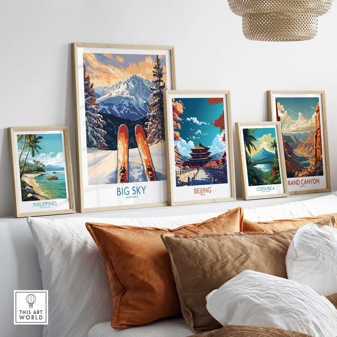 Framed art prints of Big Sky, Beijing, Costa Rica, and the Grand Canyon displayed on a shelf with decorative pillows.