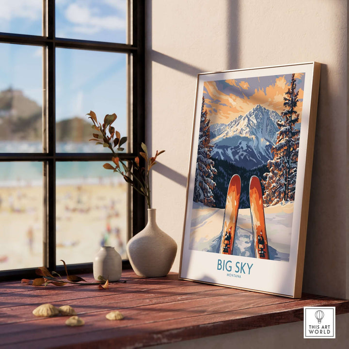 Big Sky Art Print featuring skis and mountains, displayed on a wooden table by a window, perfect for ski enthusiasts.