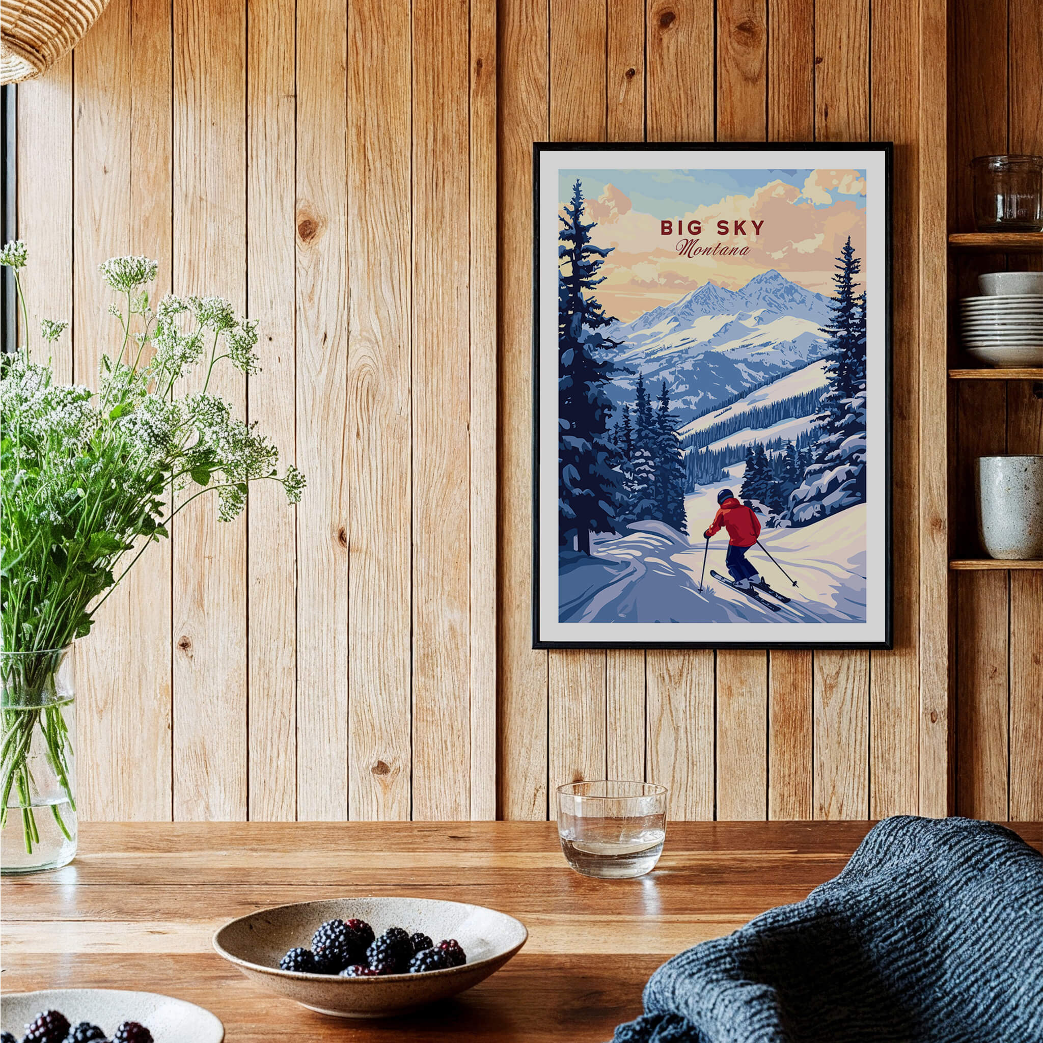 Big Sky Montana Poster - Ski Print displayed in rustic home setting with wooden decor and plants.