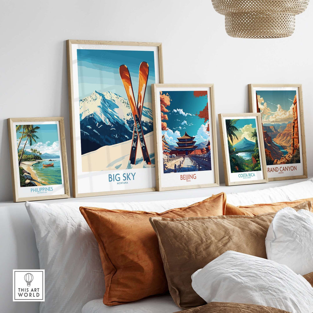 A stylish display of travel posters featuring Big Sky, Beijing, Costa Rica, and the Grand Canyon, framed and arranged on a wall.