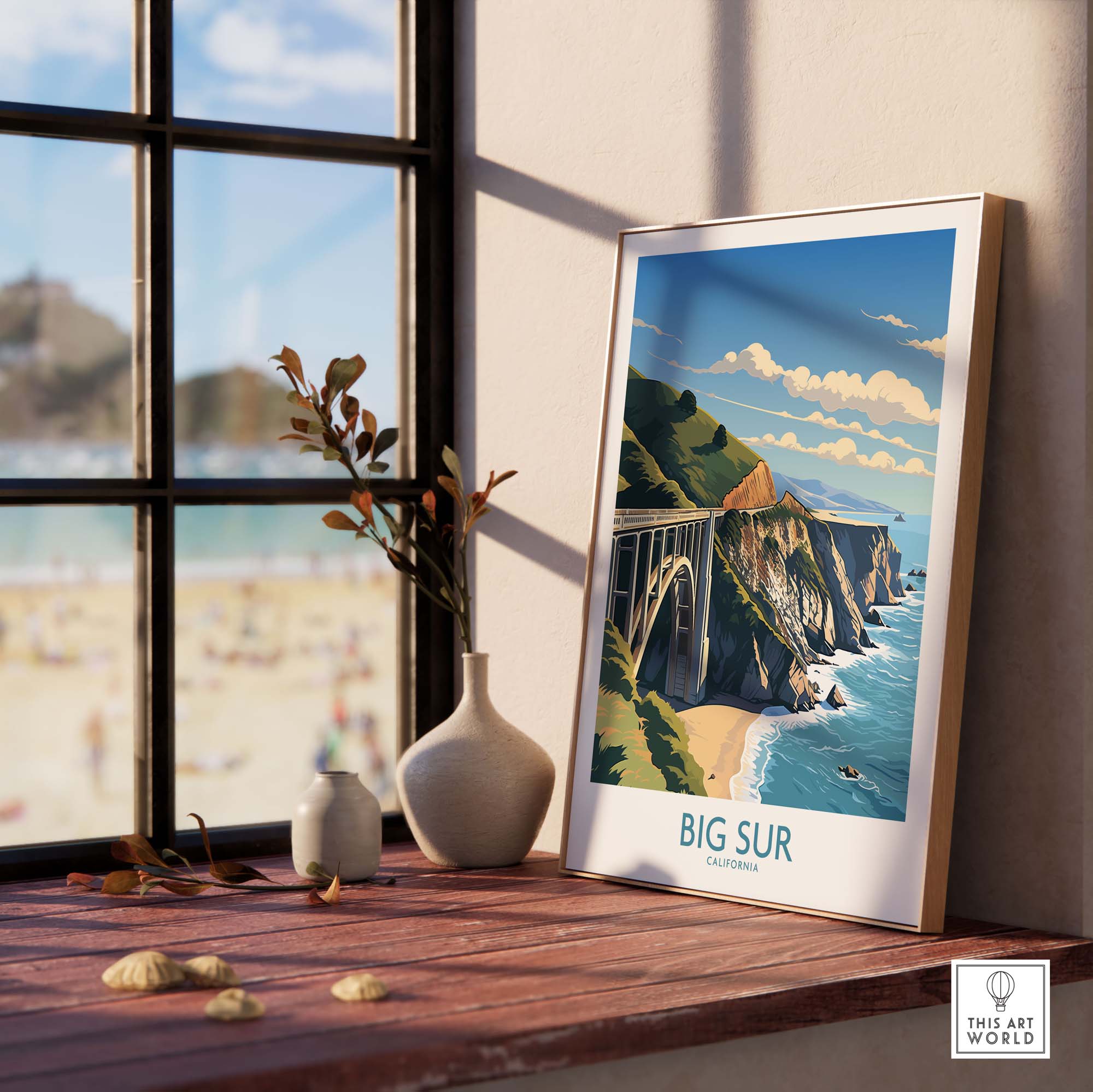 Big Sur wall art print framed near a window, showcasing the California coastline and beach views.