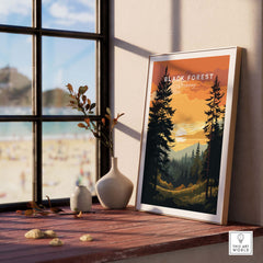 Black Forest sunset print displayed on a shelf, capturing the serene beauty of German mountains and nature.