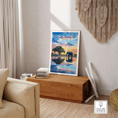 Botswana Elephant Sunset Art Print - African Wildlife Wall Decor displayed in a stylish living room setting.