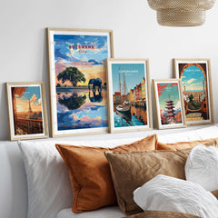 Botswana Elephant Sunset Art Print - African Wildlife Wall Decor displayed among various travel art prints on a stylish wall.