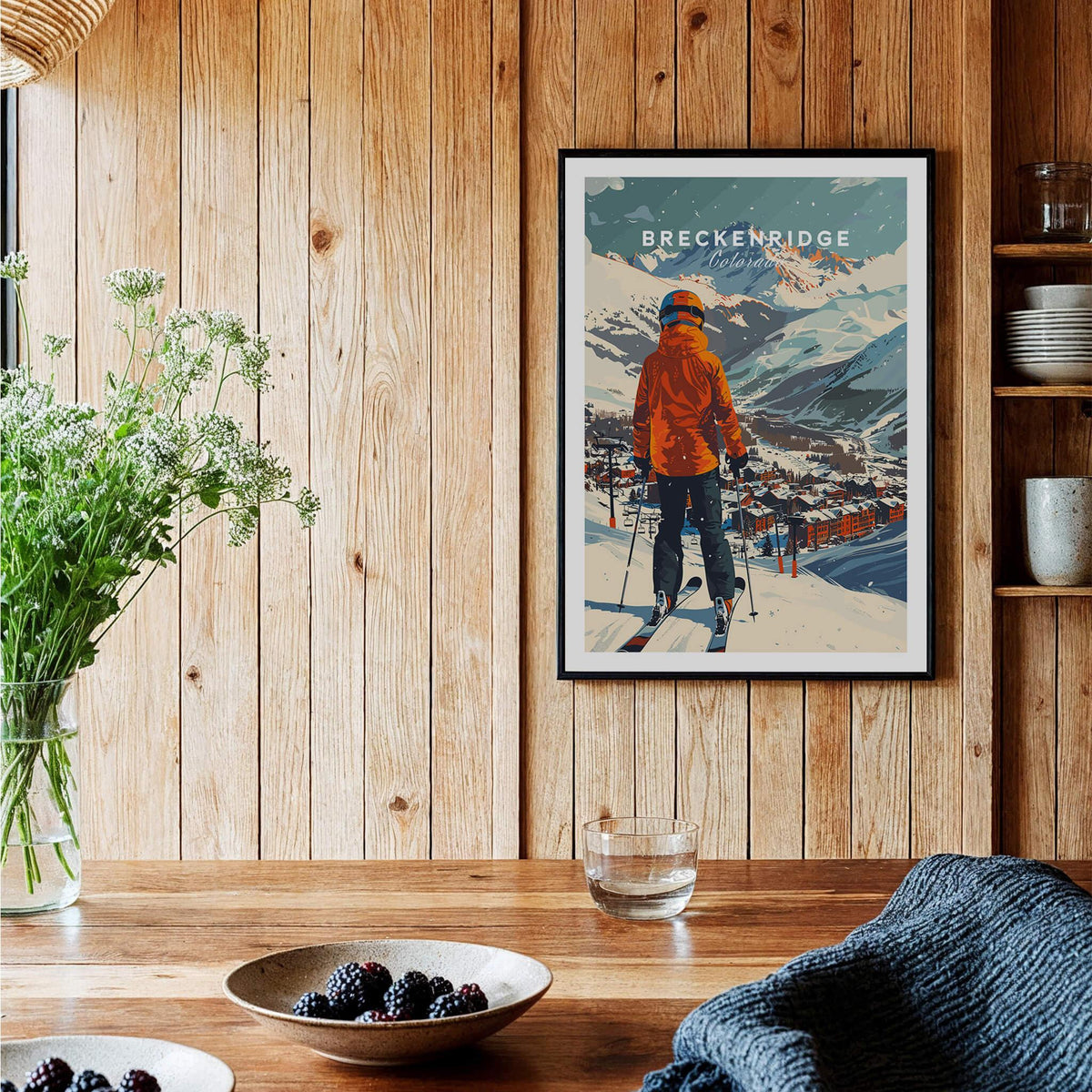 Breckenridge Ski Poster featuring a skier overlooking the snowy mountain landscape in a cozy interior setting.