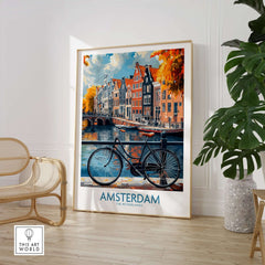 Bright Amsterdam Canal Poster - Colourful Dutch Houses Reflecting on Water Art displayed in a stylish interior with a bicycle.