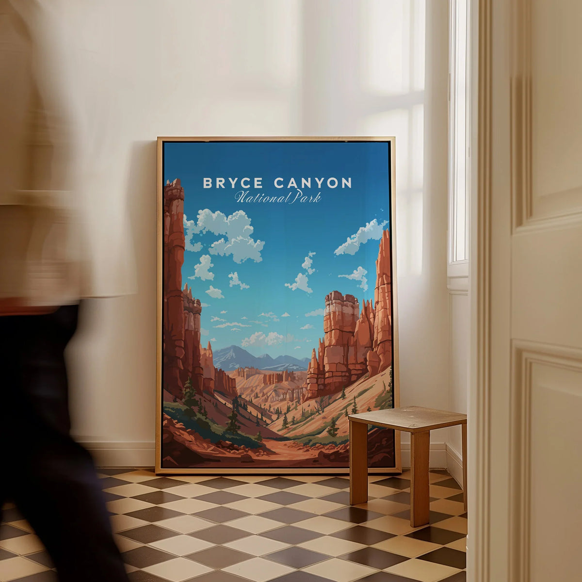 Framed Bryce Canyon National Park print on floor in bright room, person walking past