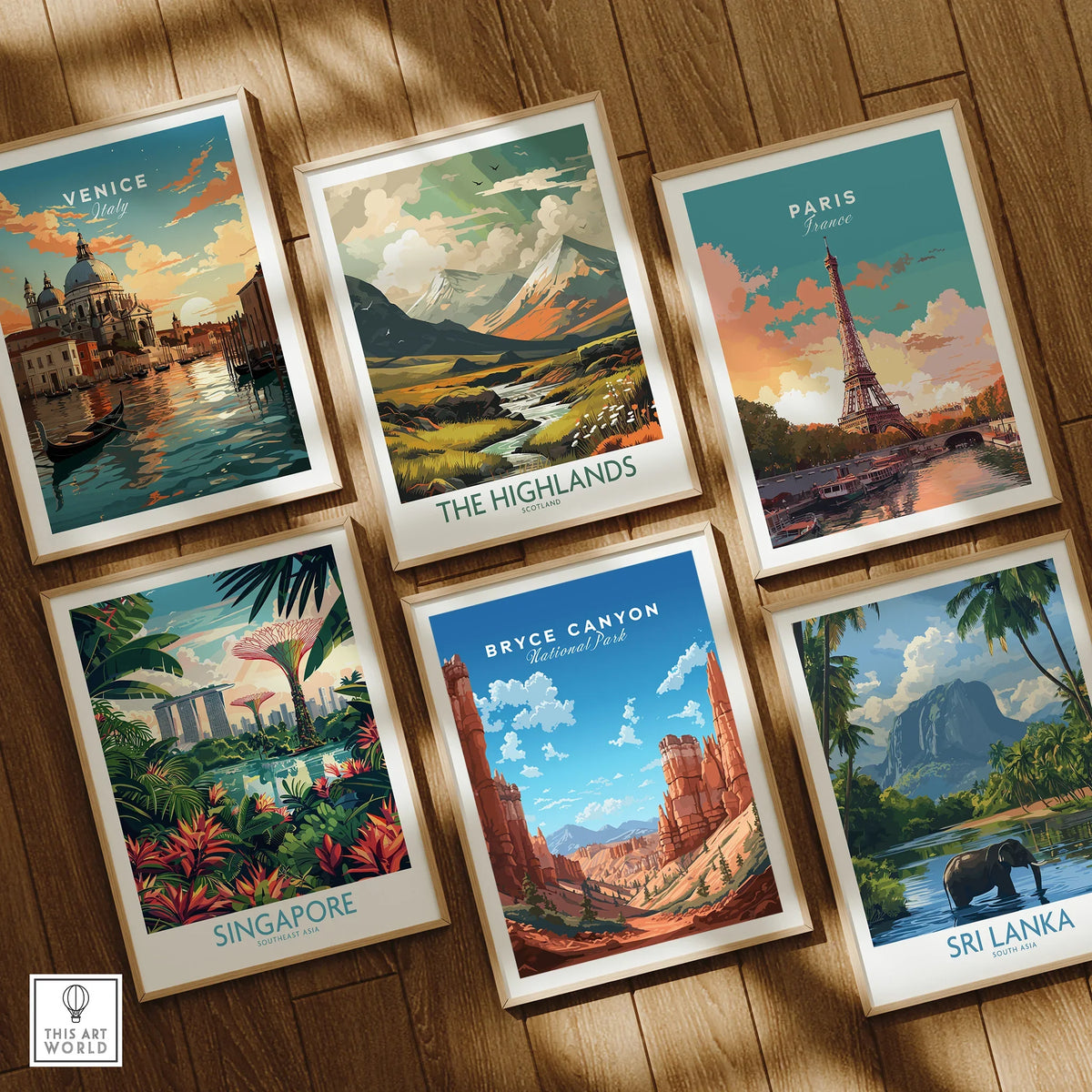 Set of six travel art prints featuring Venice, Paris, Highlands, Singapore, Bryce Canyon, and Sri Lanka, framed on a wooden floor.