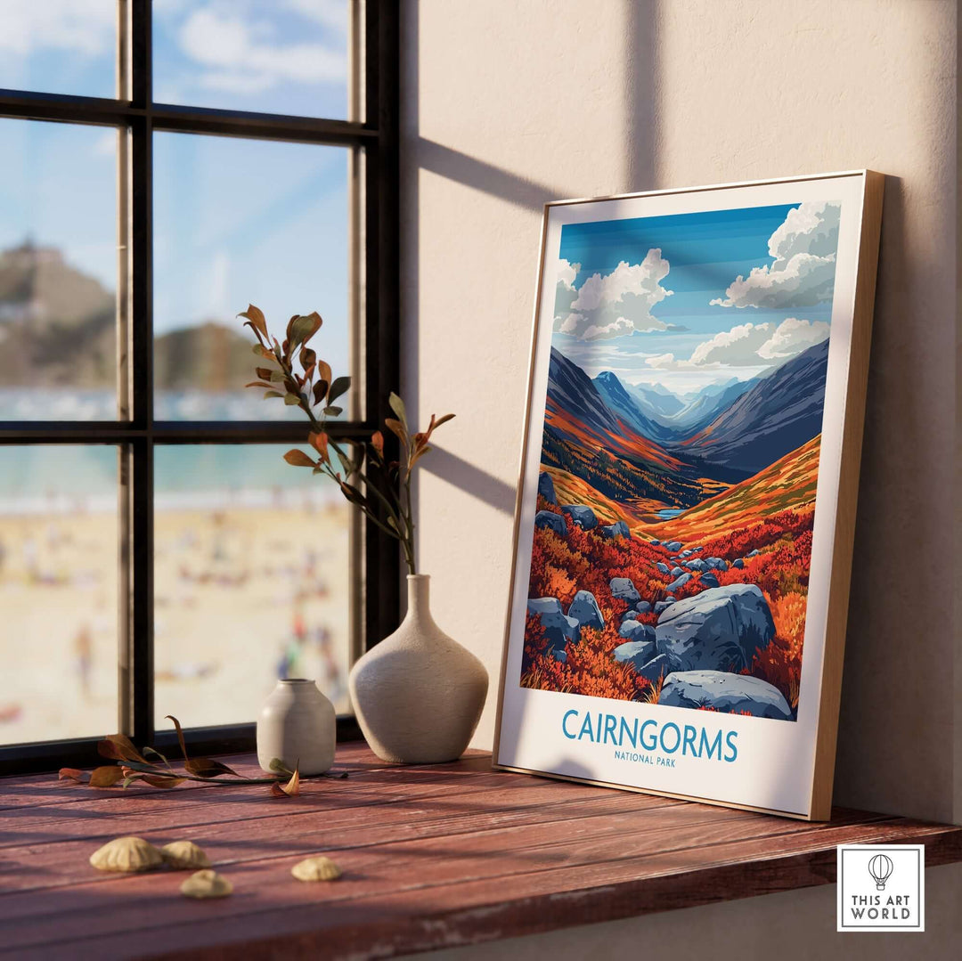 Cairngorms art print displayed on a windowsill, featuring vibrant landscapes of Cairngorms National Park.