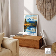 Cairngorms Poster National Park displayed in a cozy interior setting with mountain scenery.