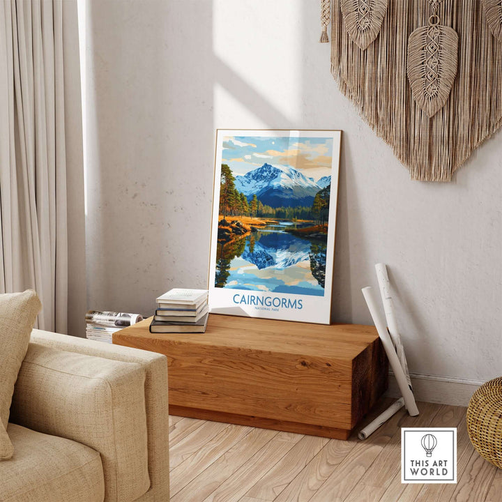 Cairngorms National Park poster displayed in a cozy living room setting, featuring mountains and a serene lake reflection.