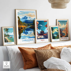 Cairngorms Poster National Park among framed travel posters on a stylish shelf decoration.