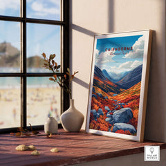 Cairngorms Print depicting vibrant landscapes of the Cairngorms in a framed setting by a window.