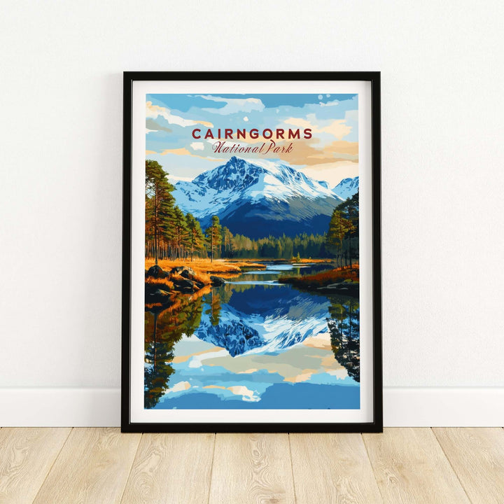 Cairngorms National Park print featuring mountains and reflections in water, framed on a wooden floor.