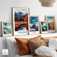 Cairngorms Travel Poster displayed among other travel posters on a modern shelf, showcasing stunning landscapes.