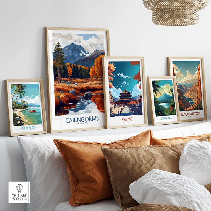 Collection of travel posters featuring Cairngorms, Beijing, Costa Rica, and the Grand Canyon displayed in a modern living room.