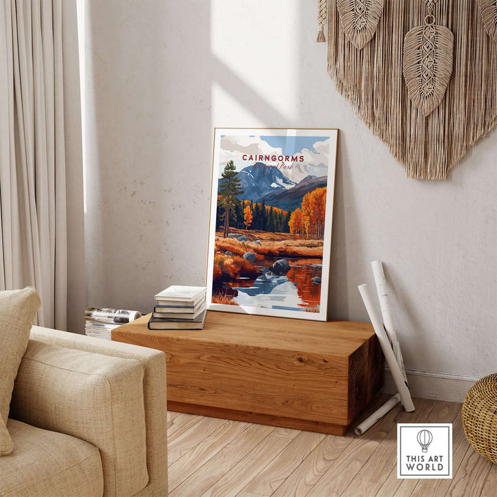 Cairngorms travel print displayed in a cozy living room setting, showcasing autumnal colors and serene landscape.