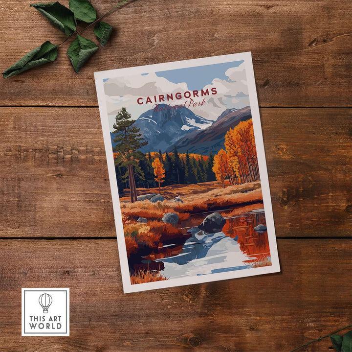 Cairngorms travel print featuring vibrant autumn scenery with mountains, trees, and a reflecting river on wooden background.