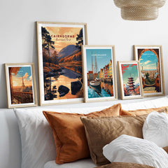 Cairngorms Wall Art and travel-themed artwork displayed on a cozy sofa arrangement.