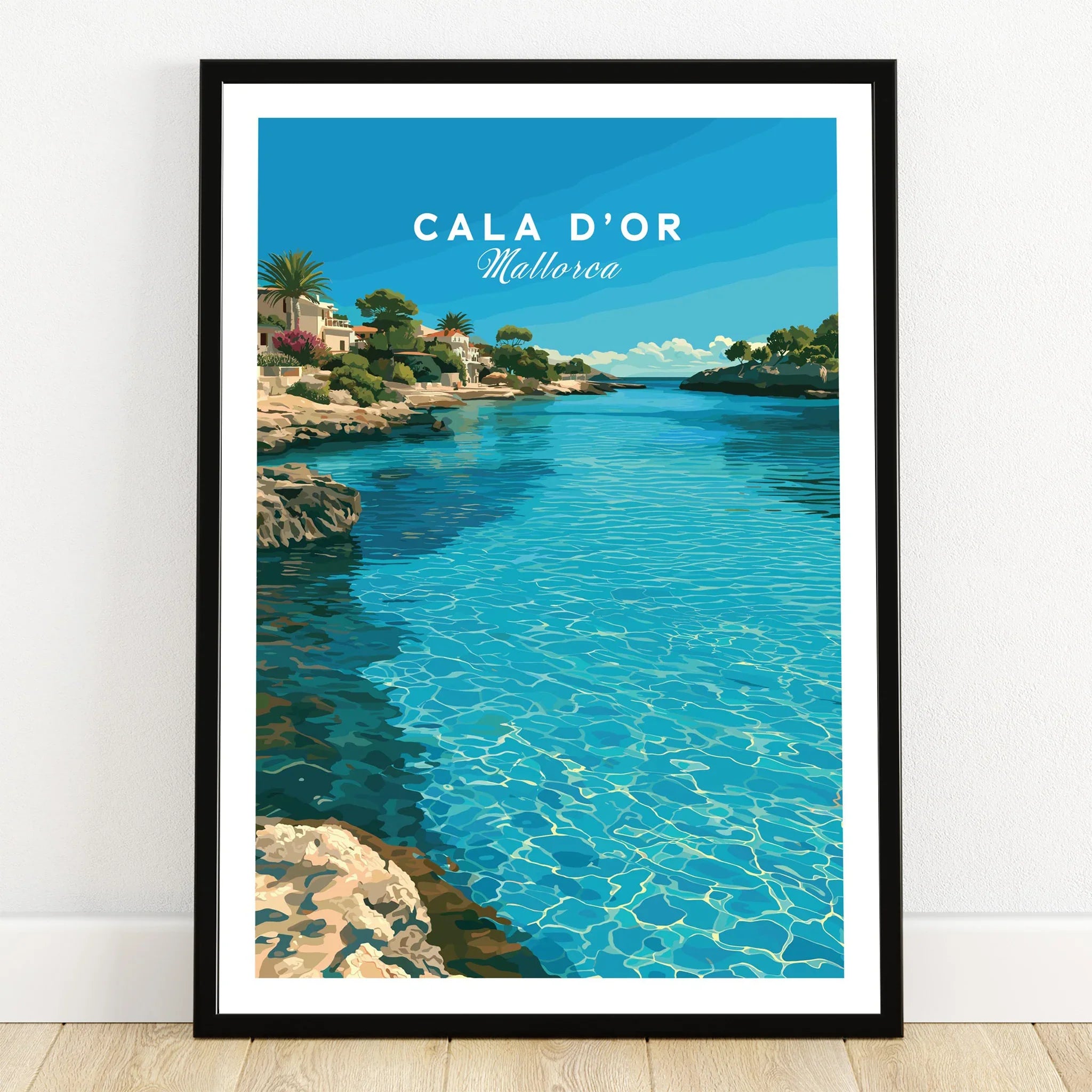 Cala d'Or Mallorca Bay Travel Poster — art print in black frame on wooden floor