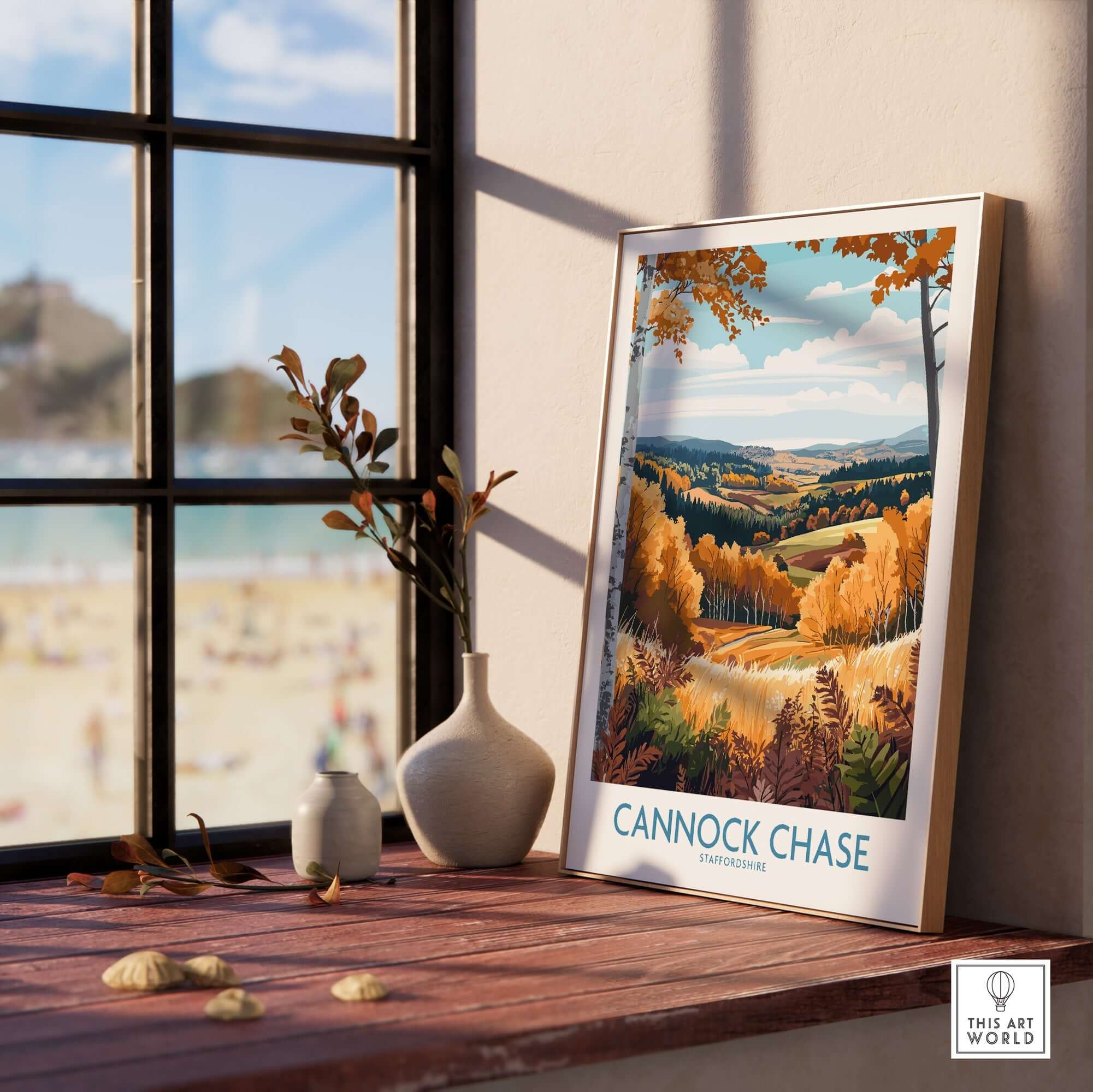 Cannock Chase Travel Poster displayed in a sunlit room by a window, showcasing a beautiful autumn landscape.
