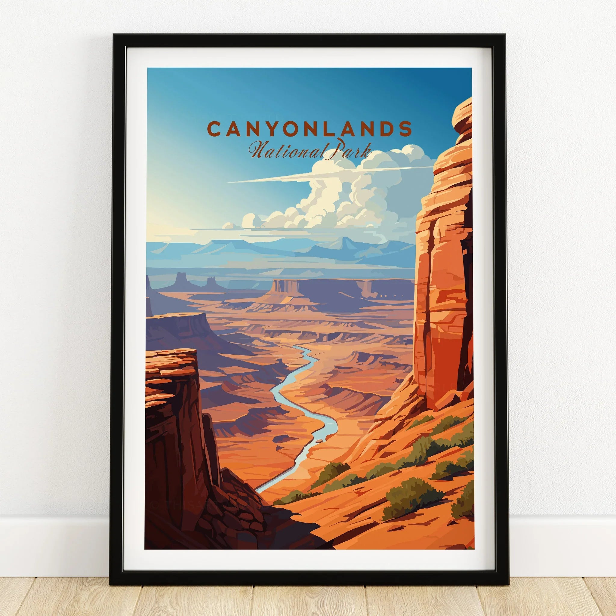 Canyonlands National Park art print in black frame on wooden floor, featuring scenic canyon view.