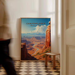Framed Canyonlands National Park travel poster on floor, person walking past in modern home.