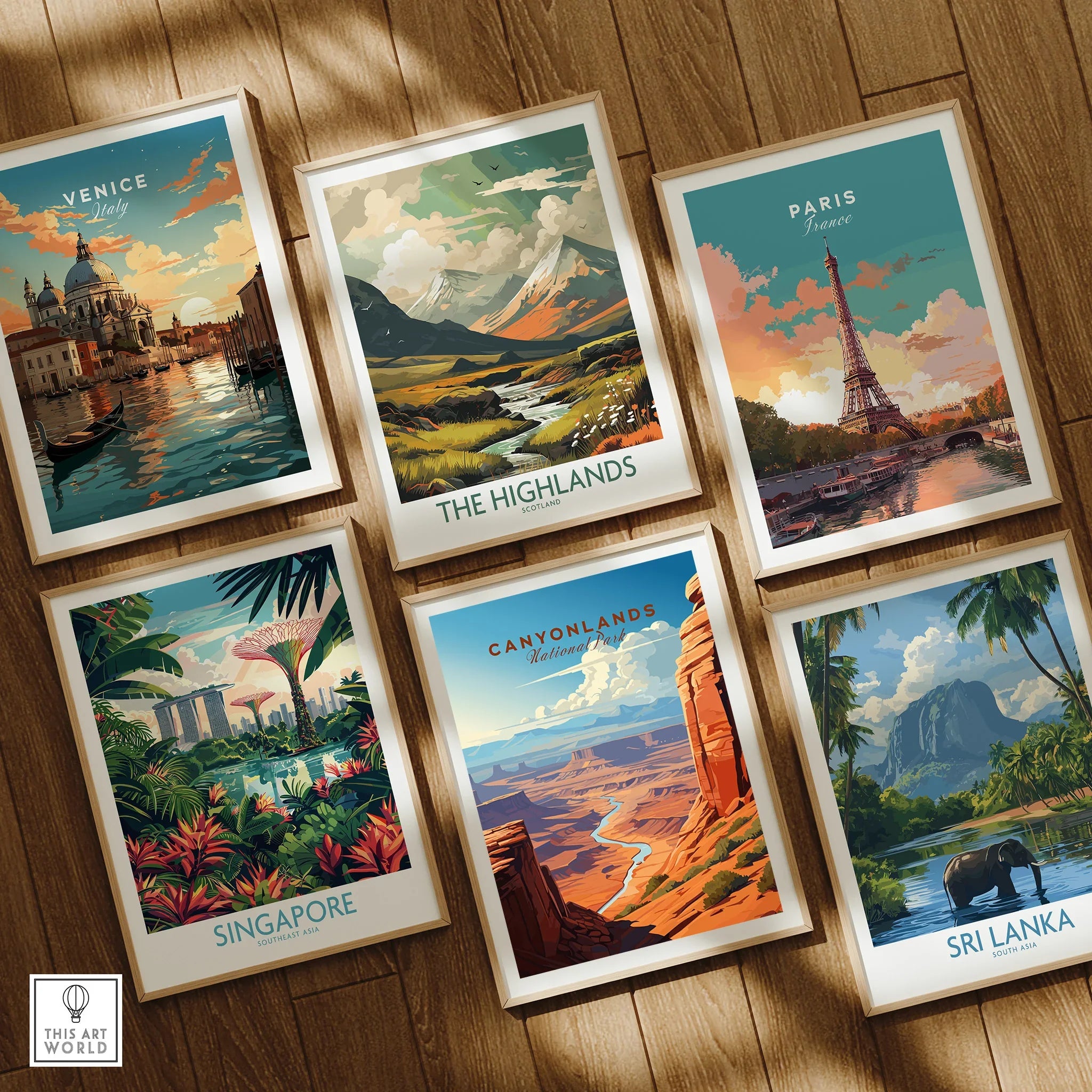 Set of six framed travel posters featuring Venice, Highlands, Paris, Singapore, Canyonlands, Sri Lanka on wooden floor