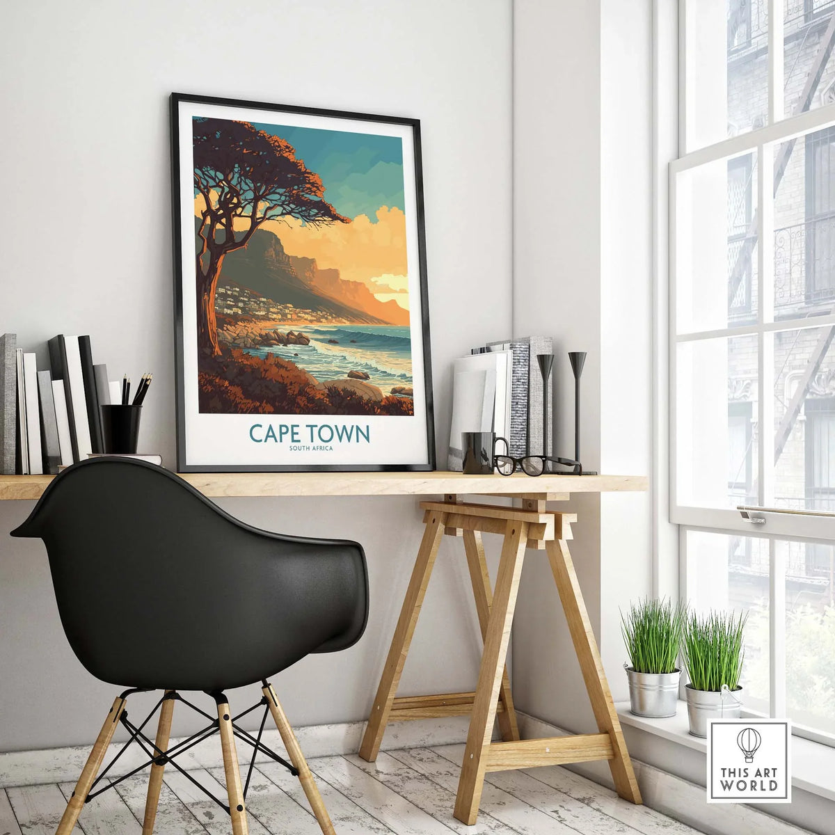 Cape Town poster showcased in a stylish home office setting, enhancing the decor with a serene coastal view of Camps Bay.