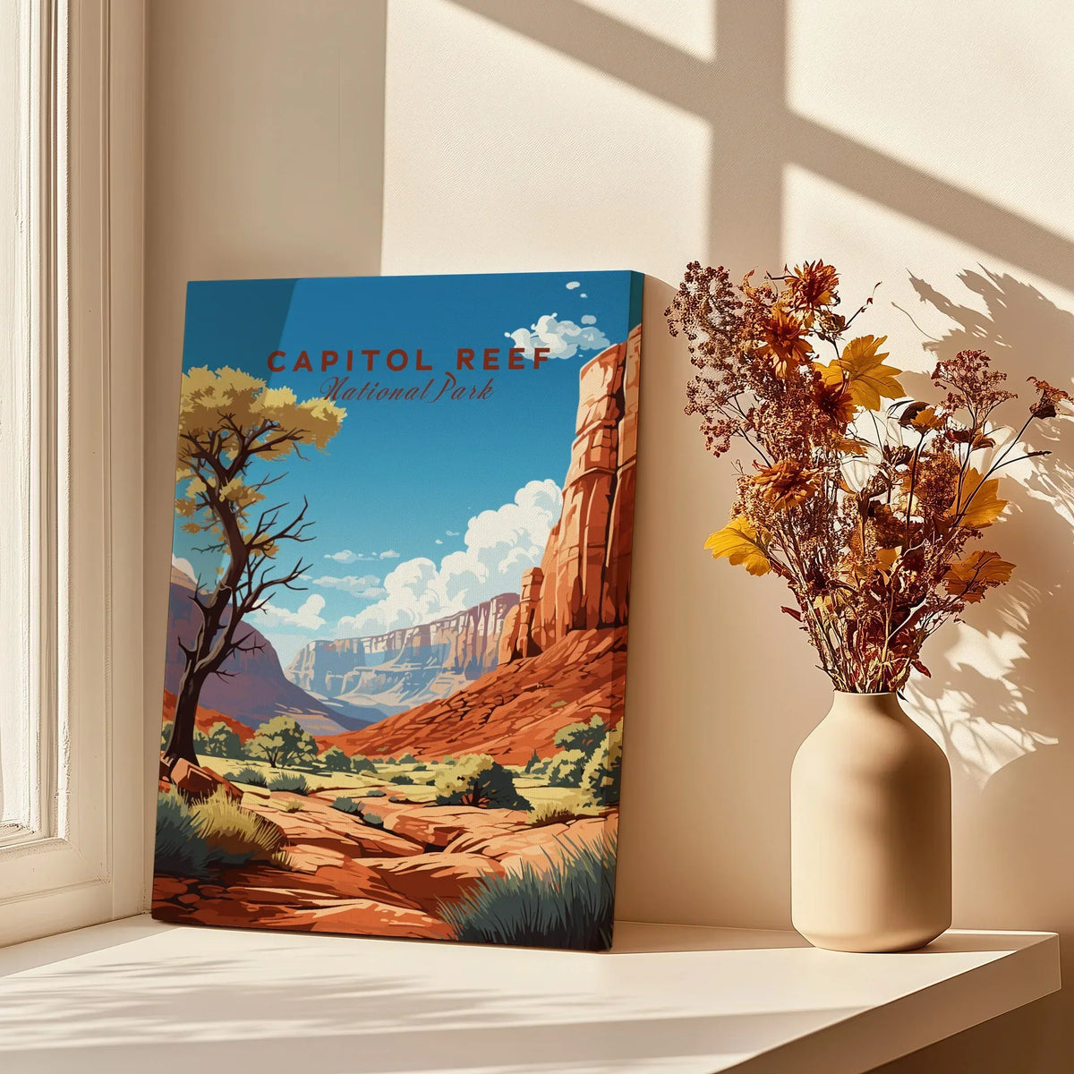 Capitol Reef National Park art print on windowsill, next to a vase with dried flowers