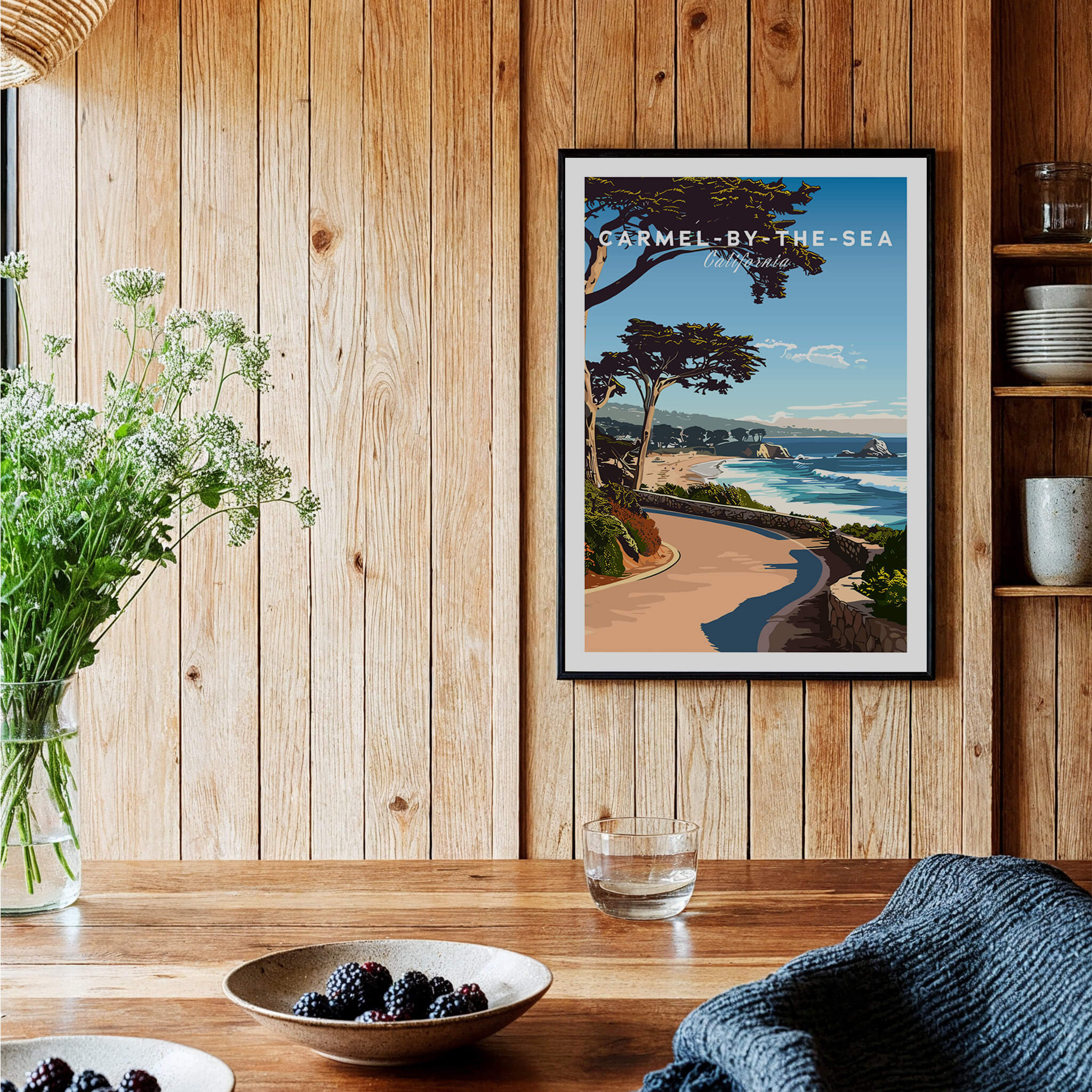 Carmel-by-the-Sea Poster Print displayed on a wooden wall, showcasing California's scenic coastal beauty.