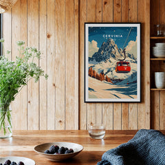 Cervinia Ski Print framed in a cozy setting with wooden walls and a beautiful mountain backdrop.