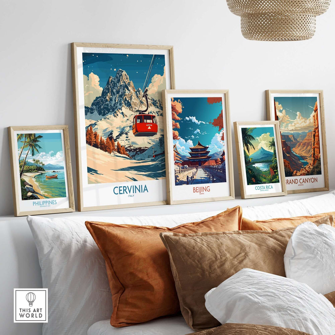 A stylish display of framed travel posters, including a vibrant Cervinia ski poster, showcasing breathtaking landscapes.