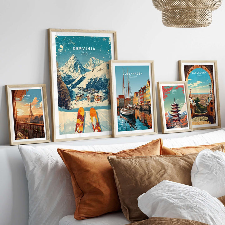 Framed Cervinia ski print with mountains and skis, surrounded by other city-themed art prints in a cozy decor setting.