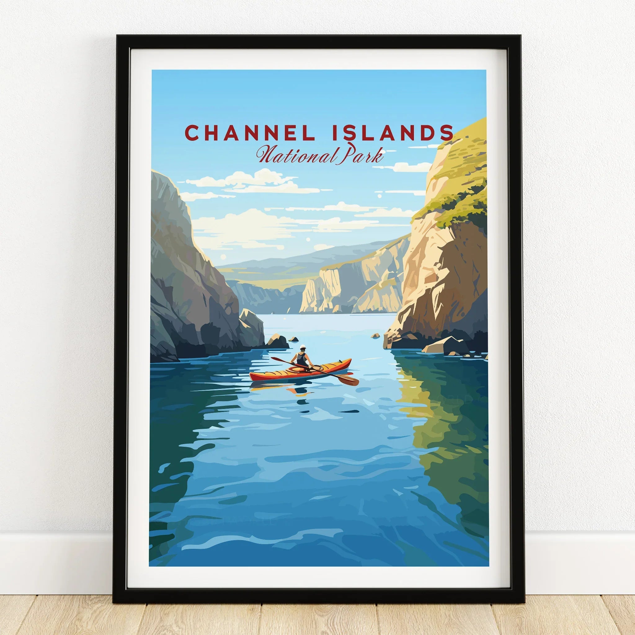 Channel Islands National Park art print in black frame, kayak on blue water between cliffs