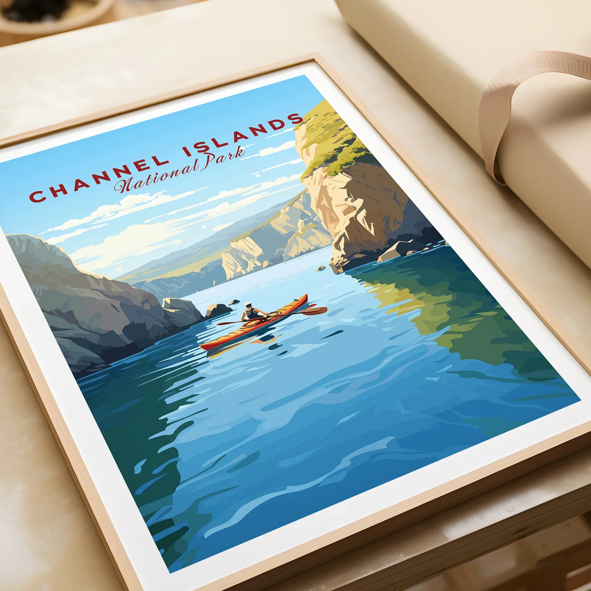 Framed Channel Islands National Park art print with kayaker, cliffs, and blue water, unwrapped as a gift