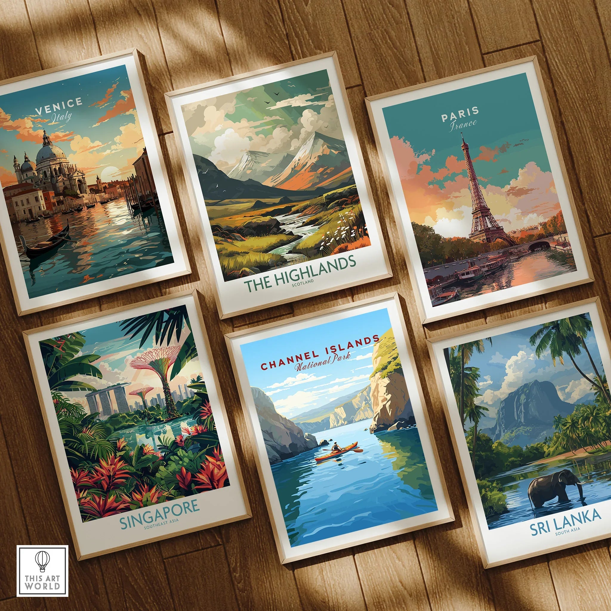 Set of six framed travel art prints featuring Venice, Paris, The Highlands, Singapore, Channel Islands, and Sri Lanka on a wooden floor.