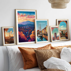 Charlottesville Virginia Poster - Skyline Art Print, Mountain View framed among various city-themed art prints on a stylish bed.