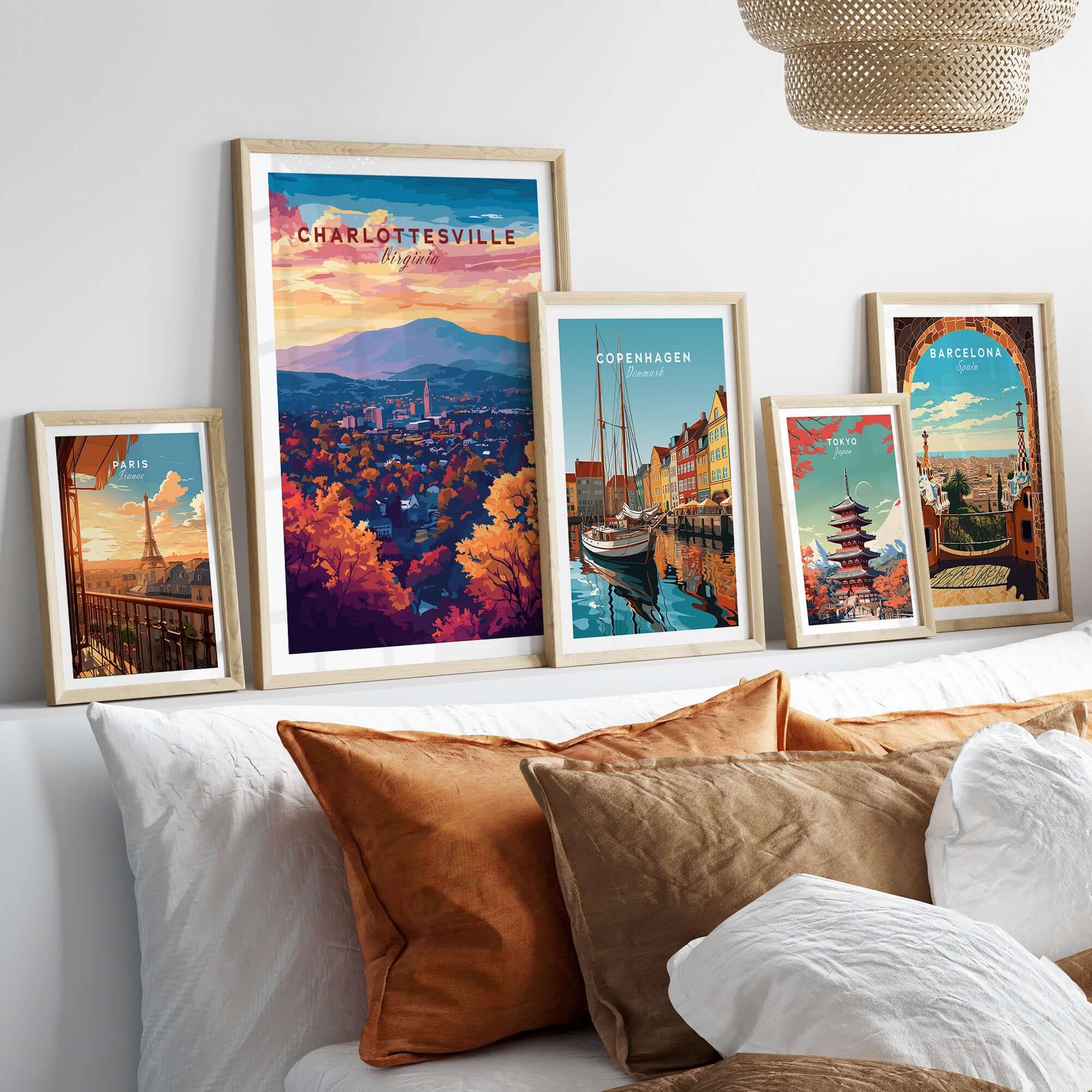 Charlottesville Virginia Poster - Skyline Art Print, Mountain View framed among various city-themed art prints on a stylish bed.